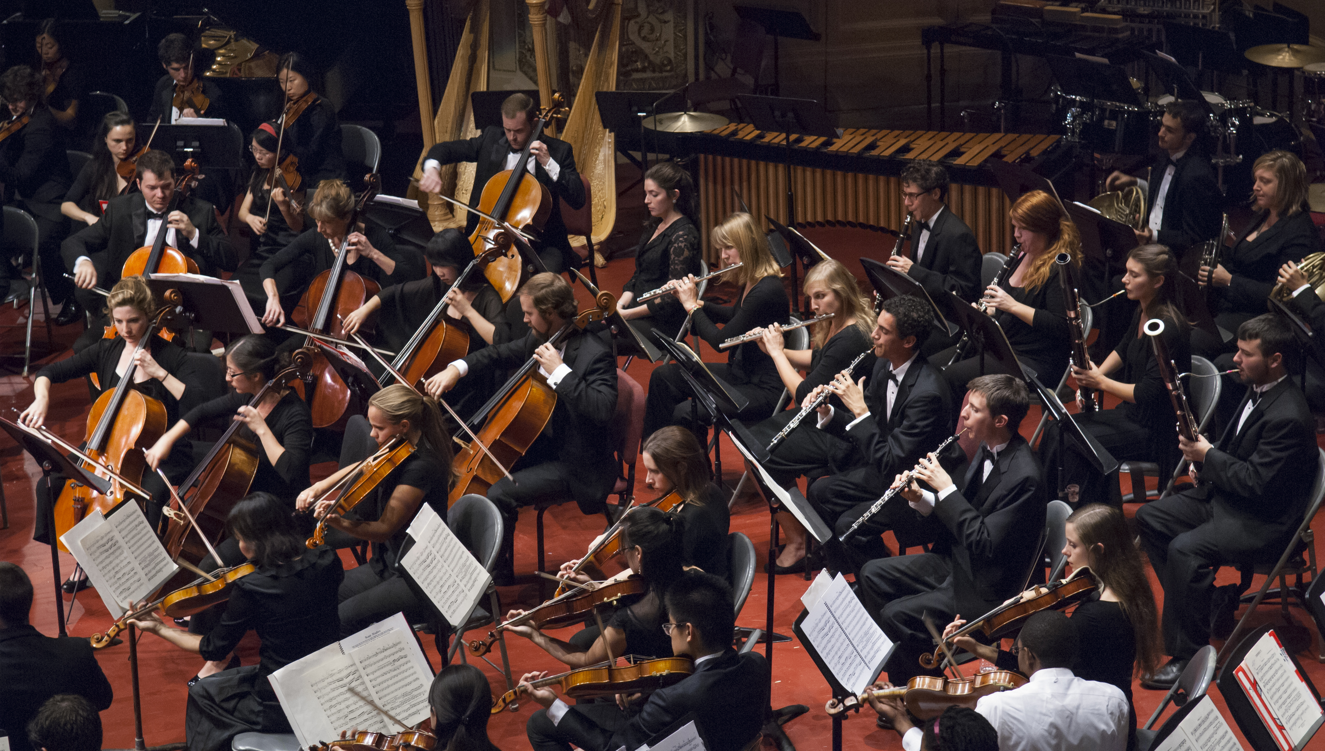 CMU students playing in a philharmonic orchestra