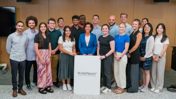 Quentin Auster, a Heinz College Master of Science in Public Policy and Management graduate, and a group of Noble Reach Scholars