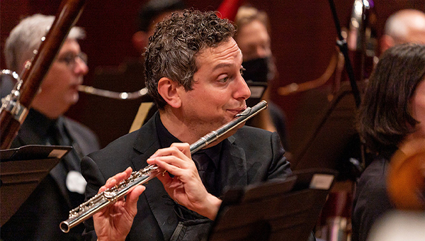 Jeffrey Barkey plays flute in the Seattle Symphony