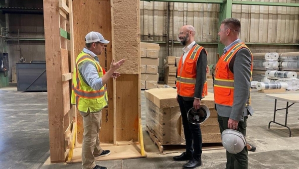 Wildfire (far right) meeting with Tech Hubs Director Eric Smith (middle) while conducting a site visit.